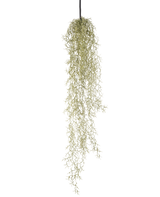 Una pianta pensile artificiale Grass 91 cm con lunghe foglie verdi chiare pendenti da un cordone nero su uno sfondo bianco.