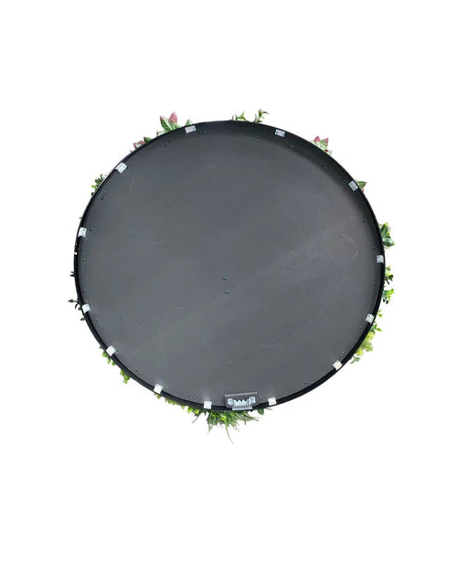 Siepe artificiale su telaio nero Ø100 cm, con piccole piante verdi e fiori rosa su vassoio rotondo nero, vista dall'alto su sfondo bianco.