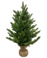 L'Albero di Natale Artificiale Mini "Munchi" 60 cm (100% PE) è un piccolo pino verde con rami fitti. La sua base è avvolta in tela e legata con spago e sta in piedi su un semplice sfondo bianco.