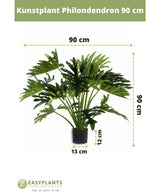 Kunstplant Philodendron UV 90 cm in een zwarte pot, met 90 cm brede bladeren. Perfect voor elke ruimte. Potmaat: 12 cm hoog, 13 cm breed. Easyplants logo onderaan.