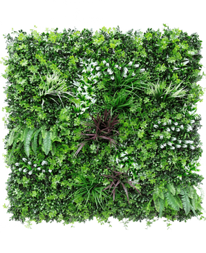 La Siepe Artificiale Sillage 100x100 cm UV è un pannello quadrato da parete con una fitta vegetazione artificiale, con varie felci e piante a fogliame per un rigoglioso e vivace effetto giardino verticale.